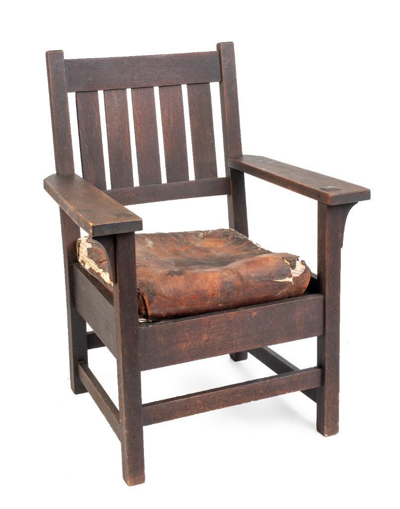 Early Gustav Stickley Armchair #318.: Signed with early decal, c. 1904, original dark finish, loose leather cushion and rope foundation. Seat height 19 inches.