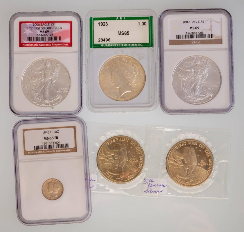 Three US Silver Dollars. (1 of 2)