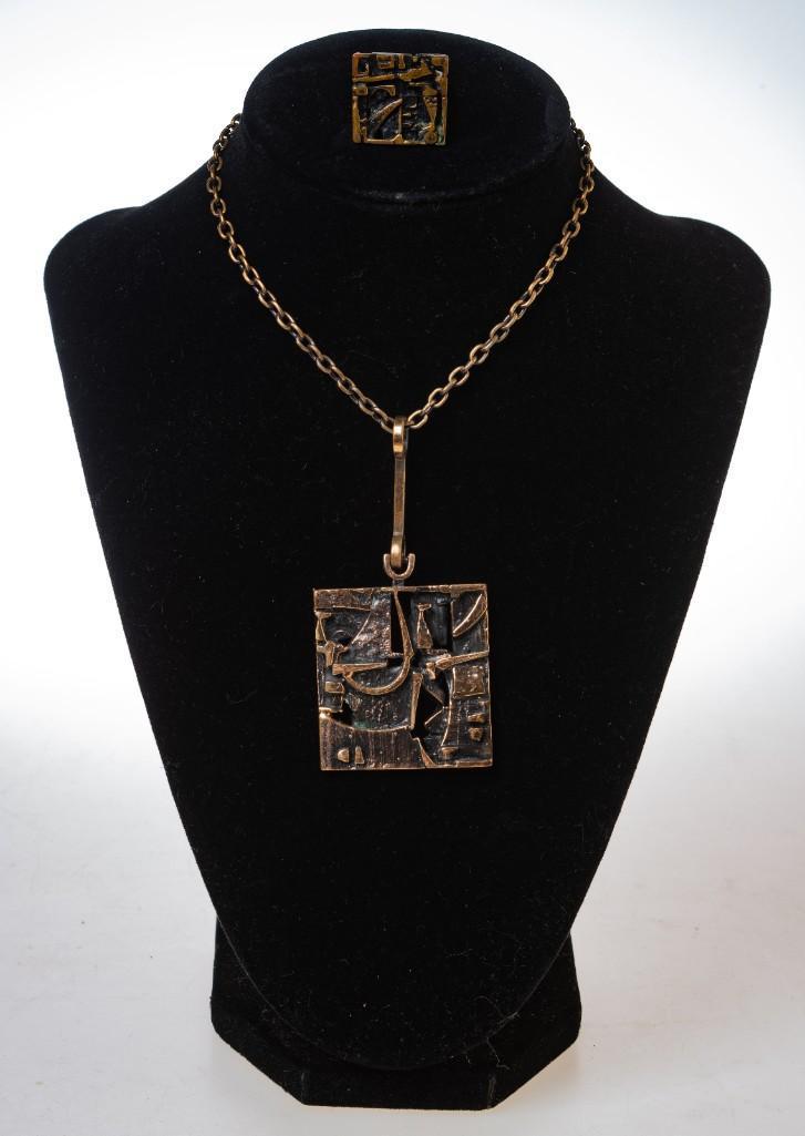 2 Pieces of Jorma Laine Modernist Jewelry.: Bronze. Finland. Necklace pendant 1.75 x 1.5 inches. Ring size adjustable.