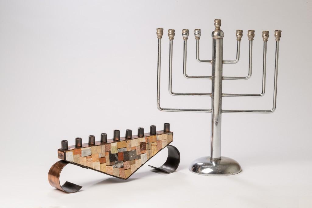 Two Modernist Menorahs.: Art Deco chrome, height 12 inches, and mid-century stone mosaic, length 11.5 inches.