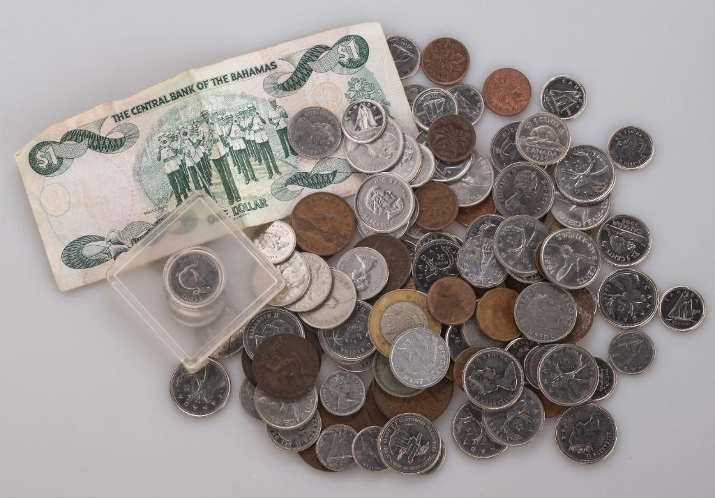 Collection of International Coins and Currency.: Bahamas, Canada, France, New Zealand, Euros, British, and others.