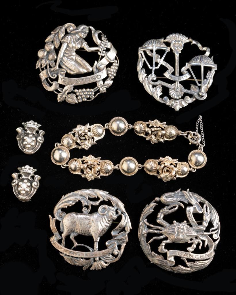 Group of Peruzzi Italian Silver Jewelry.: A pair of earrings, length .9 inches, four zodiac pins (Cancer, Aries, Virgo, Libra), and a bracelet.