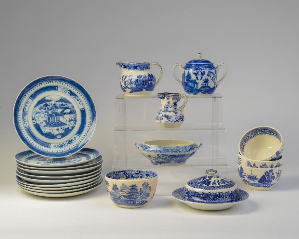Group of Blue Willow Wares: W. Ridgeways bowl, diameter 5.25 inches. Three bowls, unmarked, diameter 7.5 inches. Wood & Sons plate, diameter 7.5 inches. Sauce tureen, missing lid, sugar bowl, mason's creamer, and W. Ridgeway pit