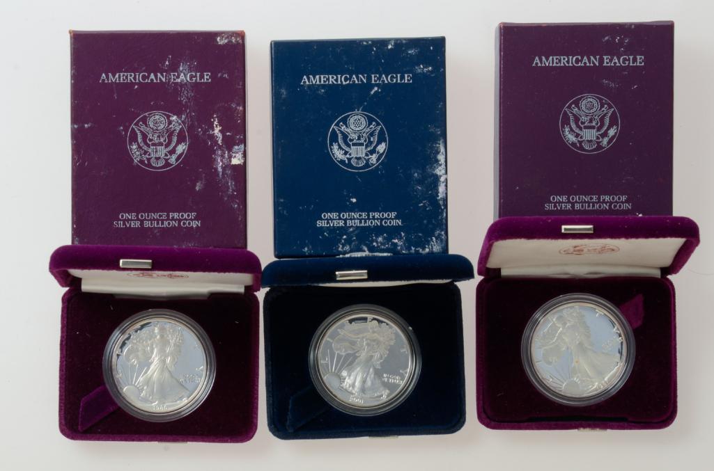 Three American Eagle Silver Bullion Coins.: 1986, 1987, 2001, each one ounce proof.