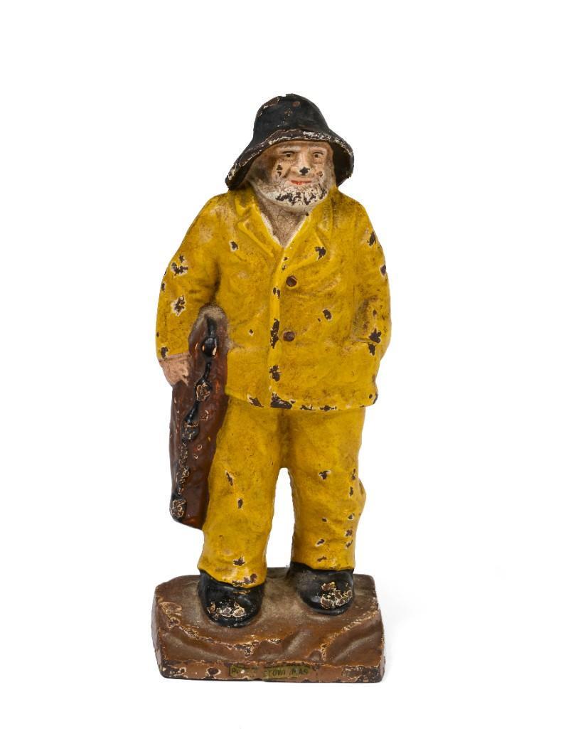 Painted Cast Iron Fisherman Door Stop.: Height 7 inches.