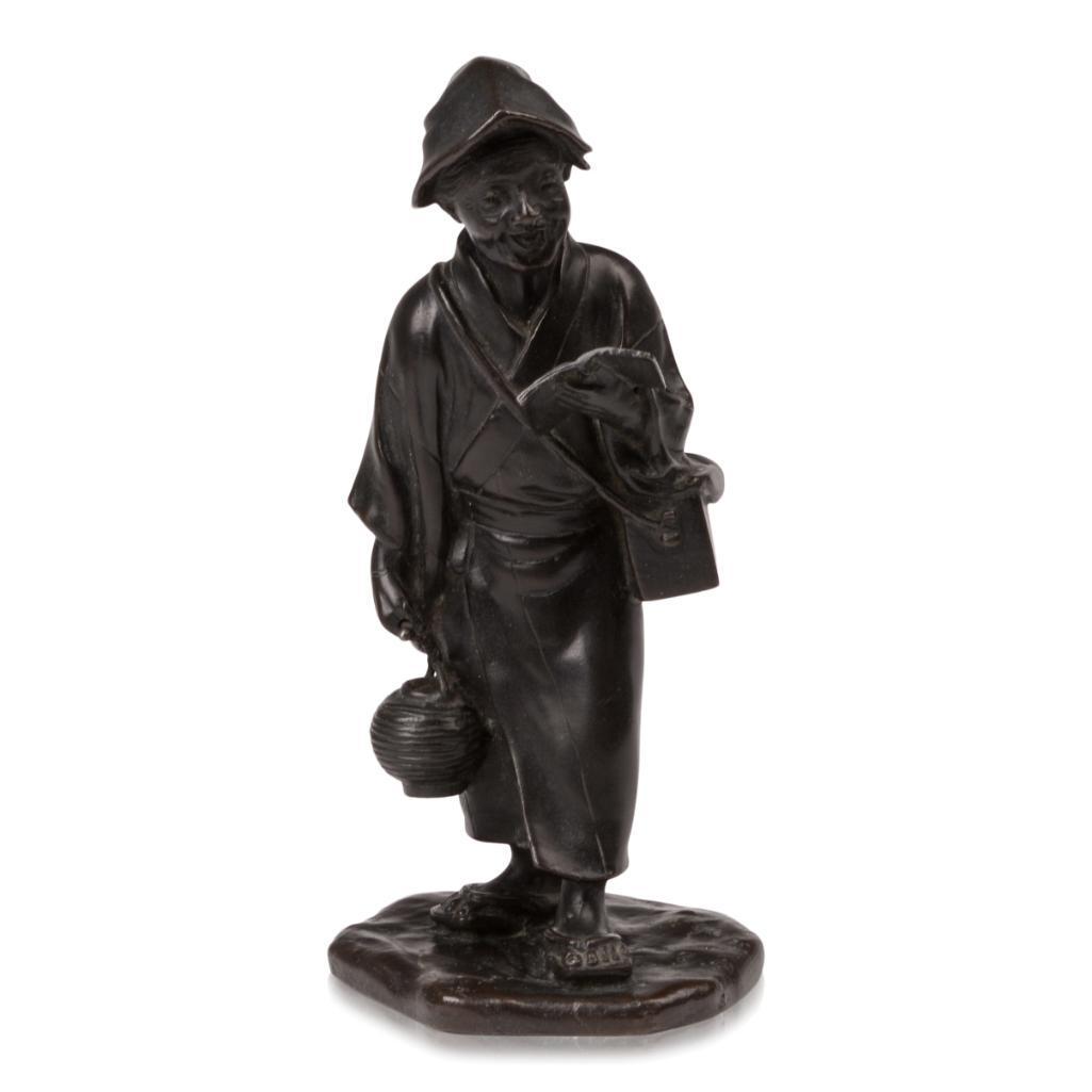 Japanese Bronze Figure of a Lady with Book and Lantern.: Meiji, signed with a seal mark. Height 7.5 inches.
