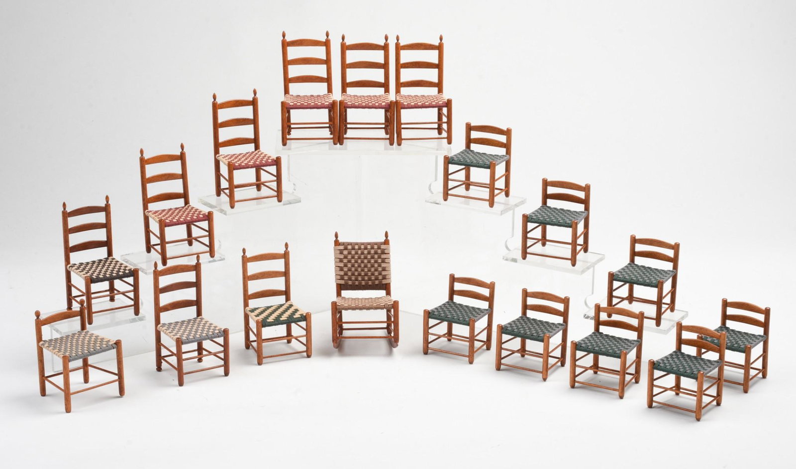 Seventeen Shaker Dollhouse Chairs.: Together with a rocking chair.