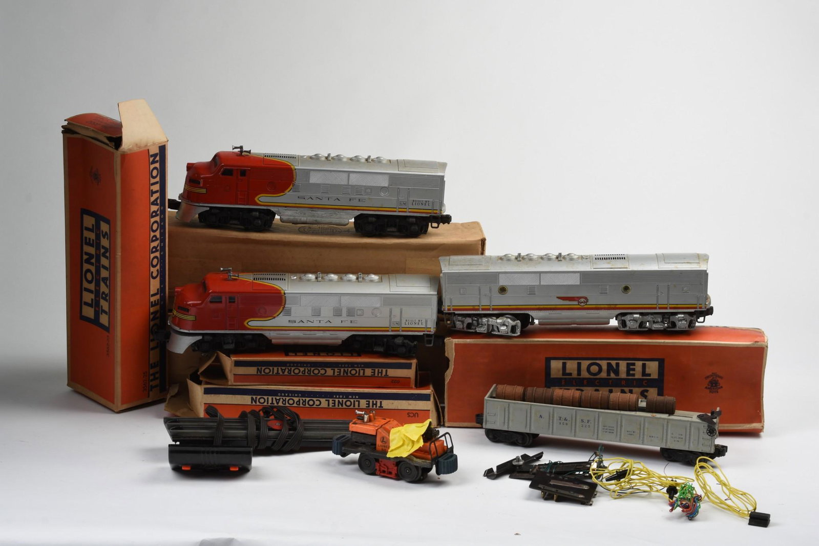 Lionel Locomotive, Cars and Accessories.: Santa Fe 2383 P Locomotive, original box Santa Fe 2383 T Locomotive, original box 3562-25 Barrel Car, original box 50 Gang Car, original box 2343C Diesel Powered B Unit, original box 022 Switches Remo