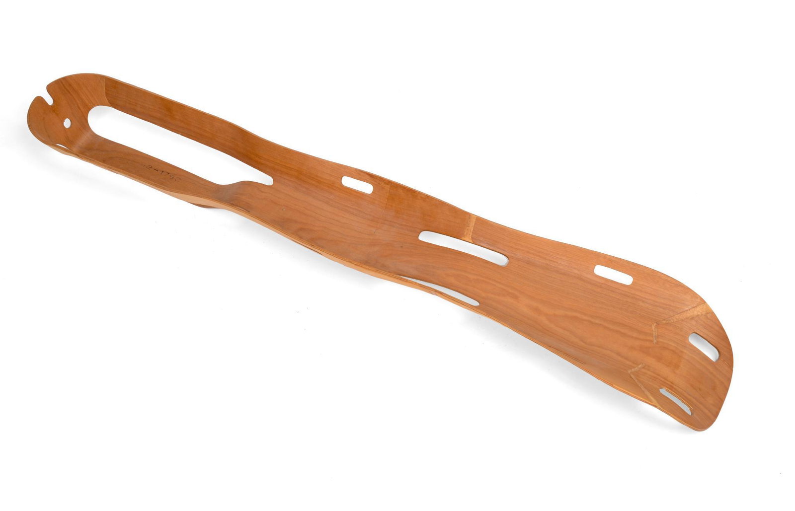 Charles and Ray Eames Molded Plywood Leg Splint.: Circa 1942, this piece was designed to replace or augment steel splints during WWII. Length 42 inches, a couple small cracks throughout.