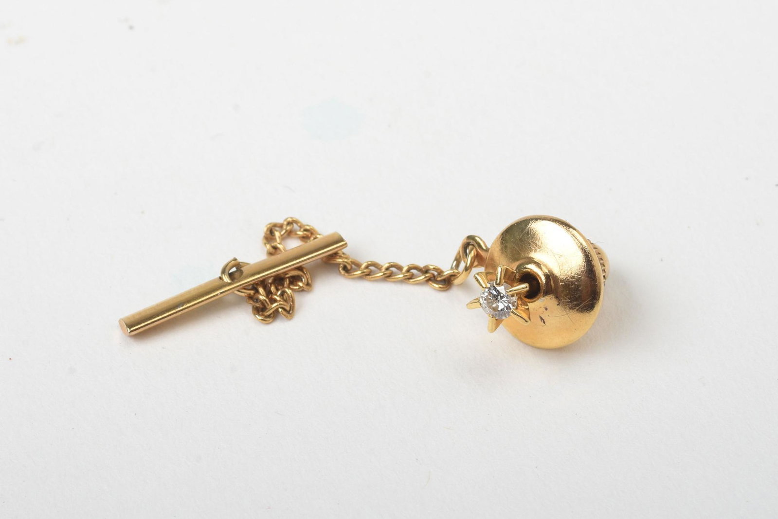 14K Yellow Gold & Diamond Tie Tack Lapel Pin.: .33 grams, stone 2.5mm