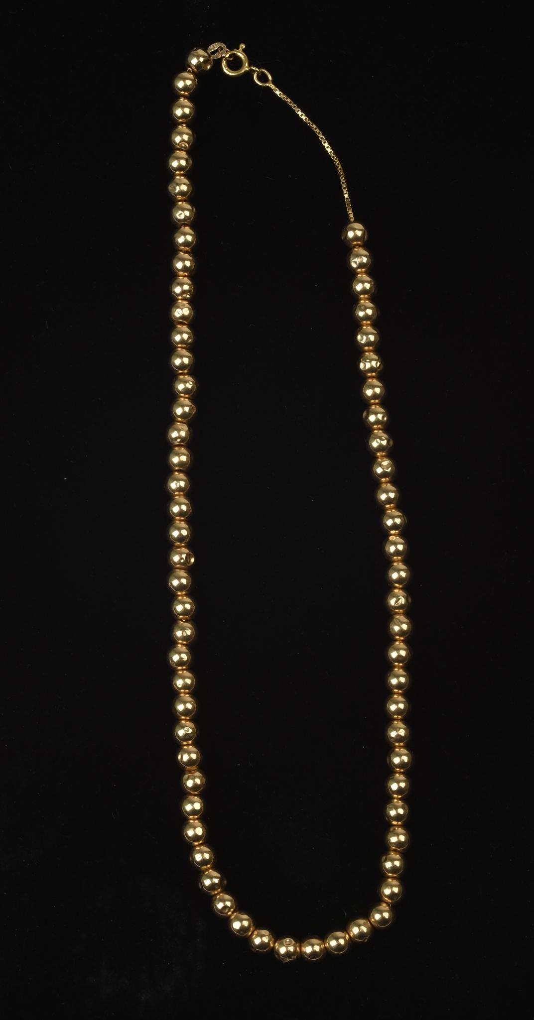 14K Yellow Gold Necklace.: With hollow beads, length 15 inches, 10 grams. Dents to beads.