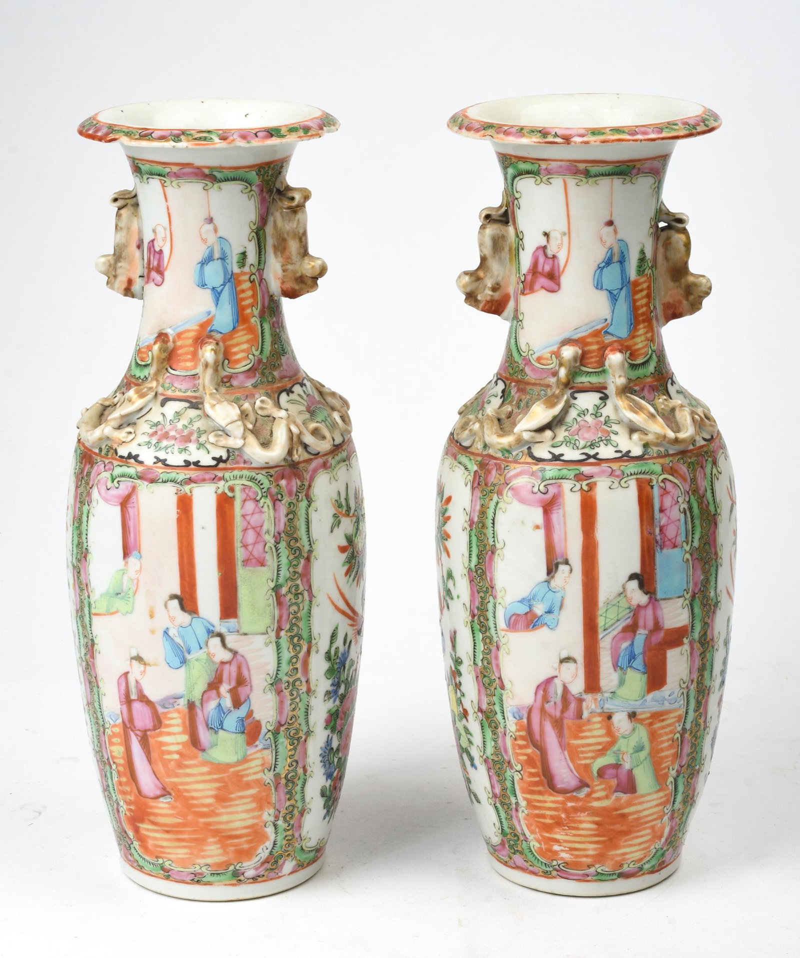 Pair of Chinese Famille Rose Vases.: Height 12 inches. Chips to rims, gilding loss.