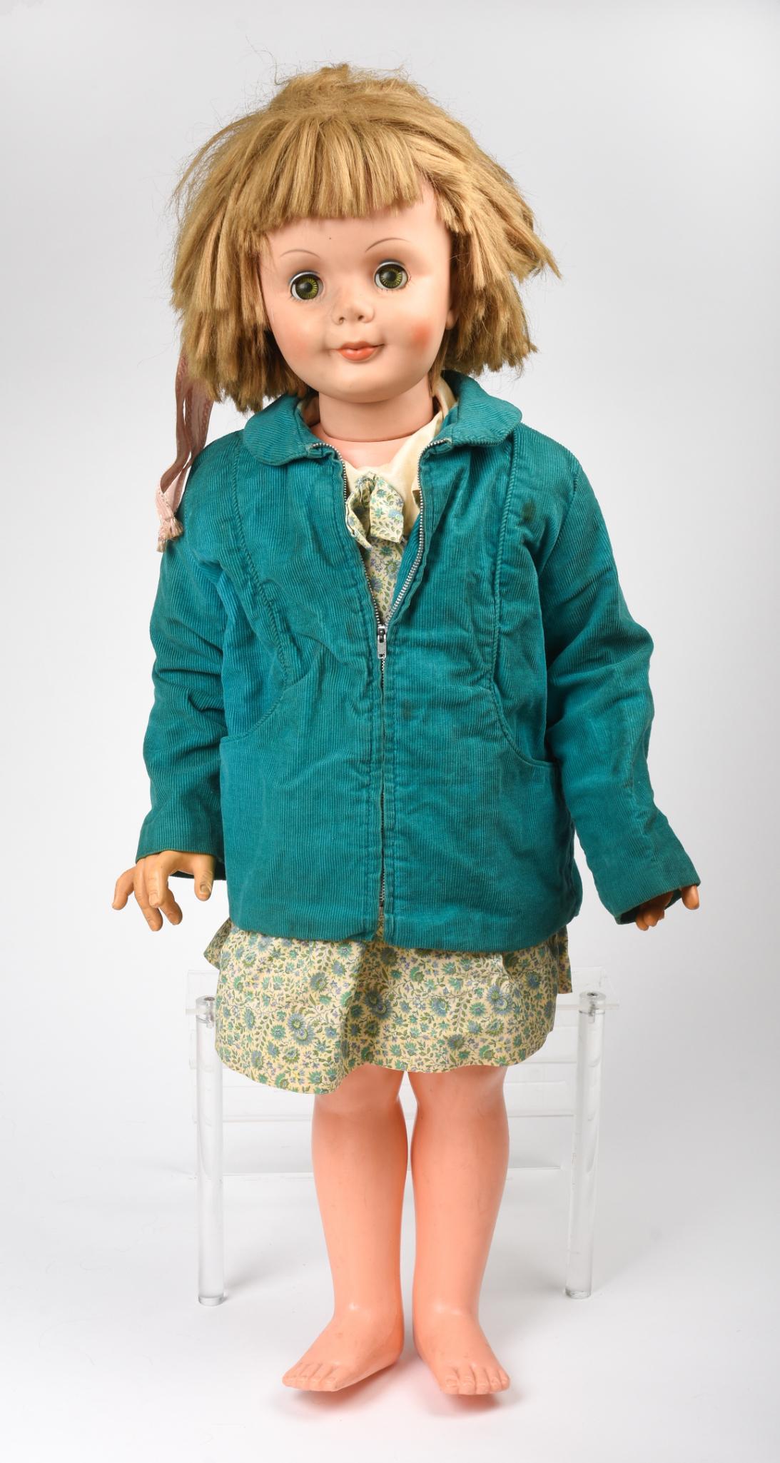 Large Vintage Doll.: Height 33 inches, together with a suitcase full of assorted doll clothing.