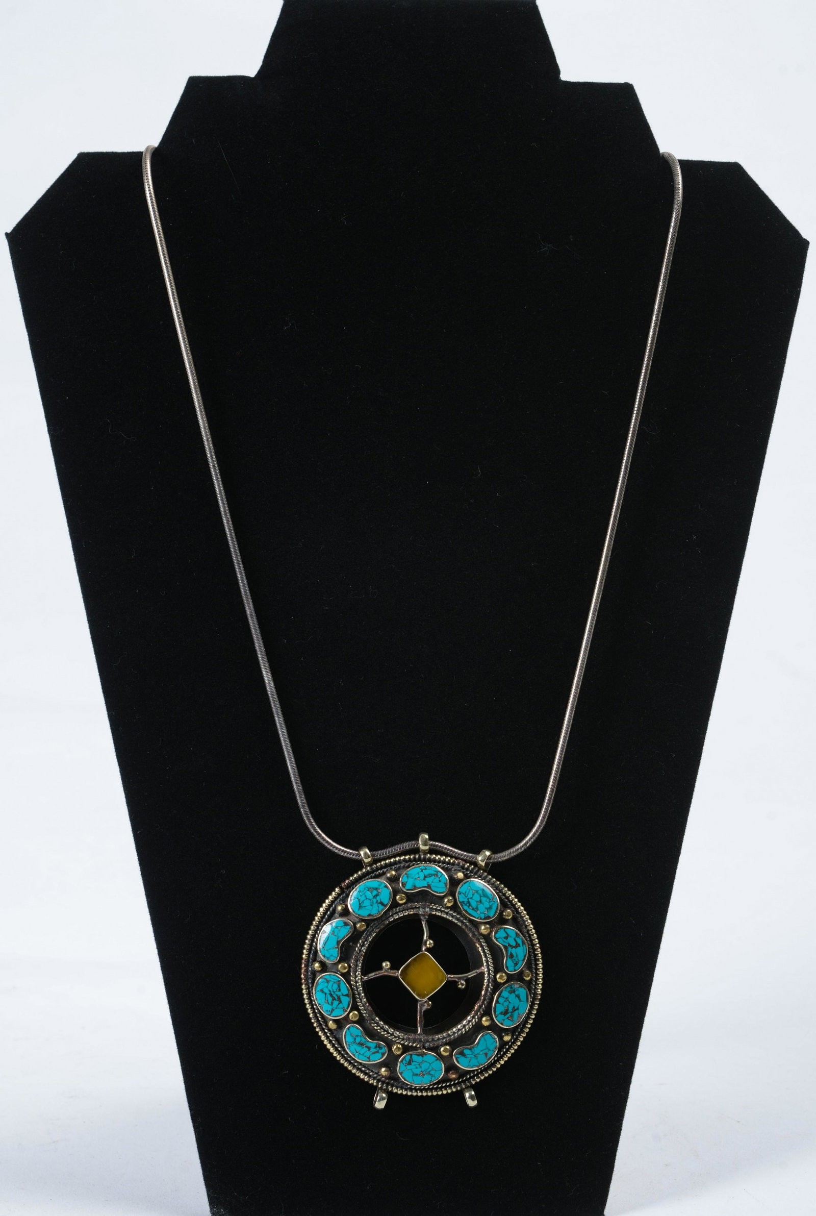 Sterling Silver Handmade Turquoise and Hardstone: Length of chain 30 inches. Diameter of pendant 2.75 inches.