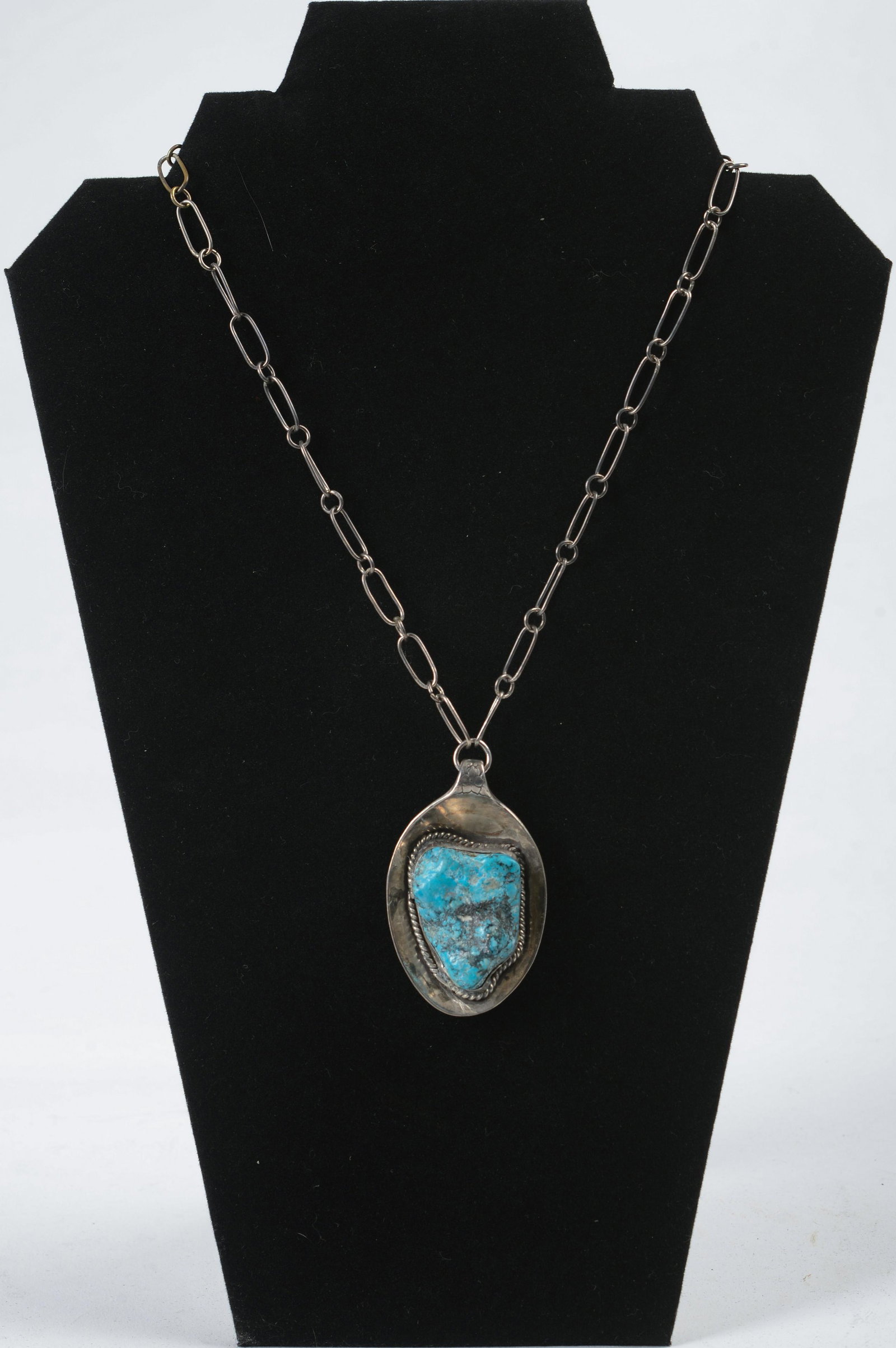 Handmade Turquoise and Sterling Necklace.: Unsigned. Tested Sterling. Length of chain 17 inches. Length of drop 2.5 inches.