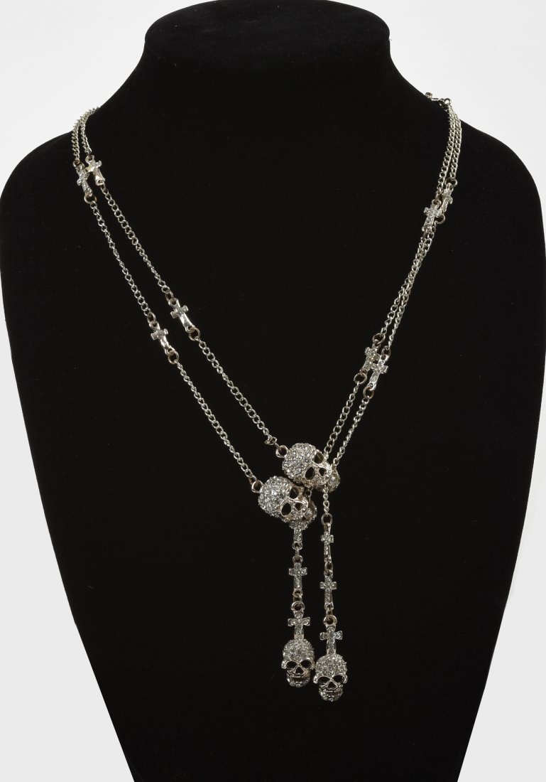 Group of Three Skull Necklaces.: One with crosses, and two with guns. Chain lengths 20 inches, 15 inches, and 10 inches.