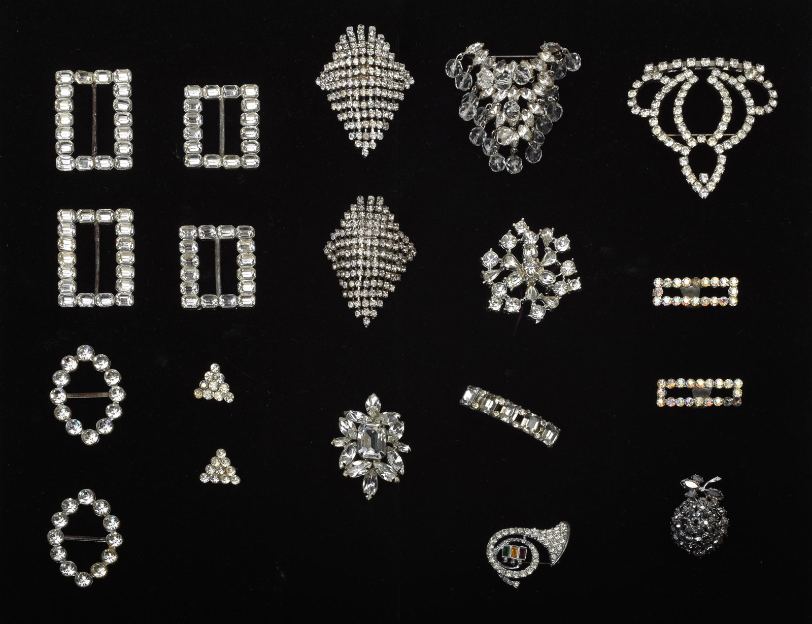 Group of Rhinestone Shoe Clips and Pins.: From the 1940s. Nineteen pieces total.