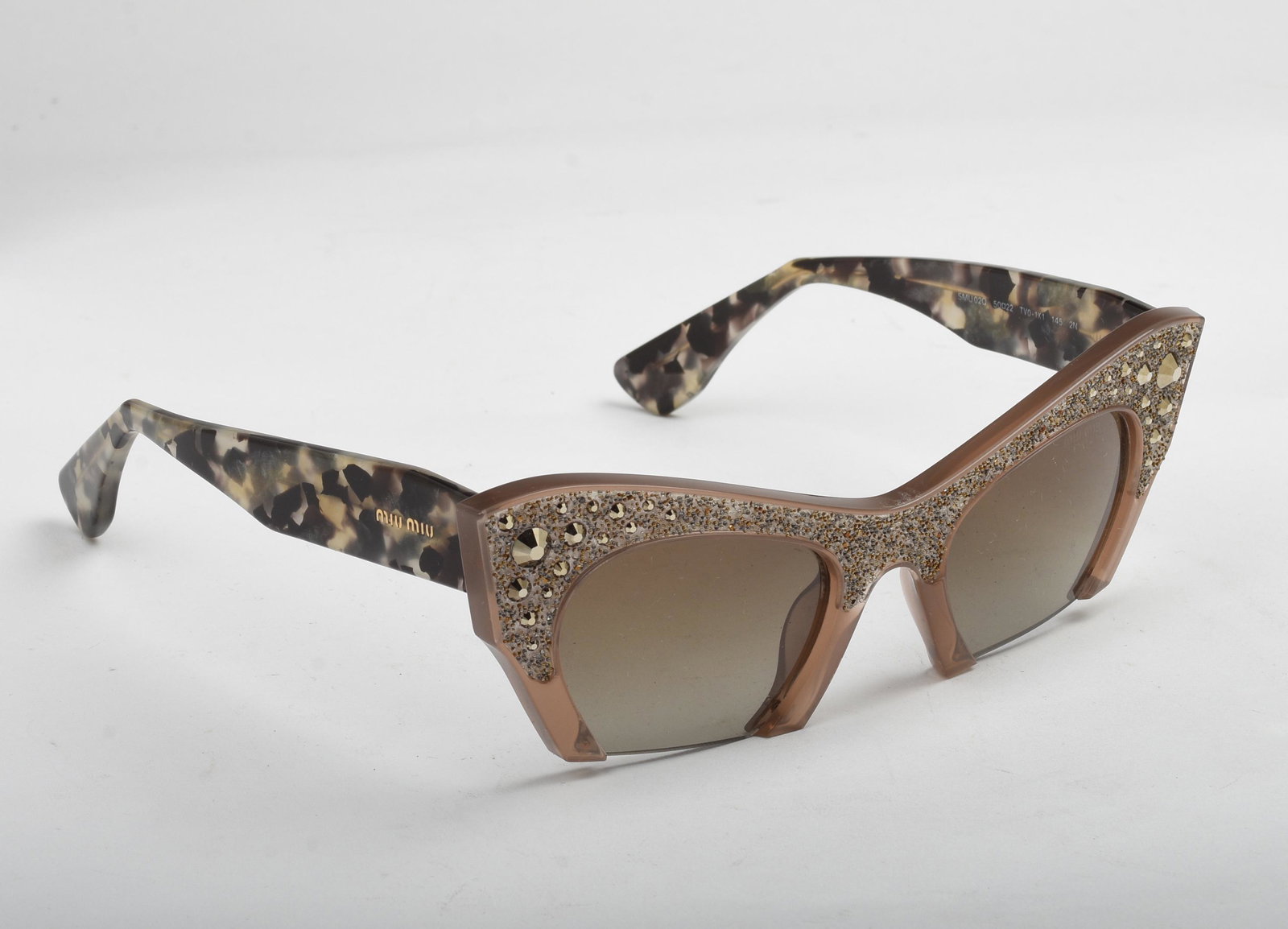 Pair of Miu Miu Cat Sunglasses.: Like new, in box.