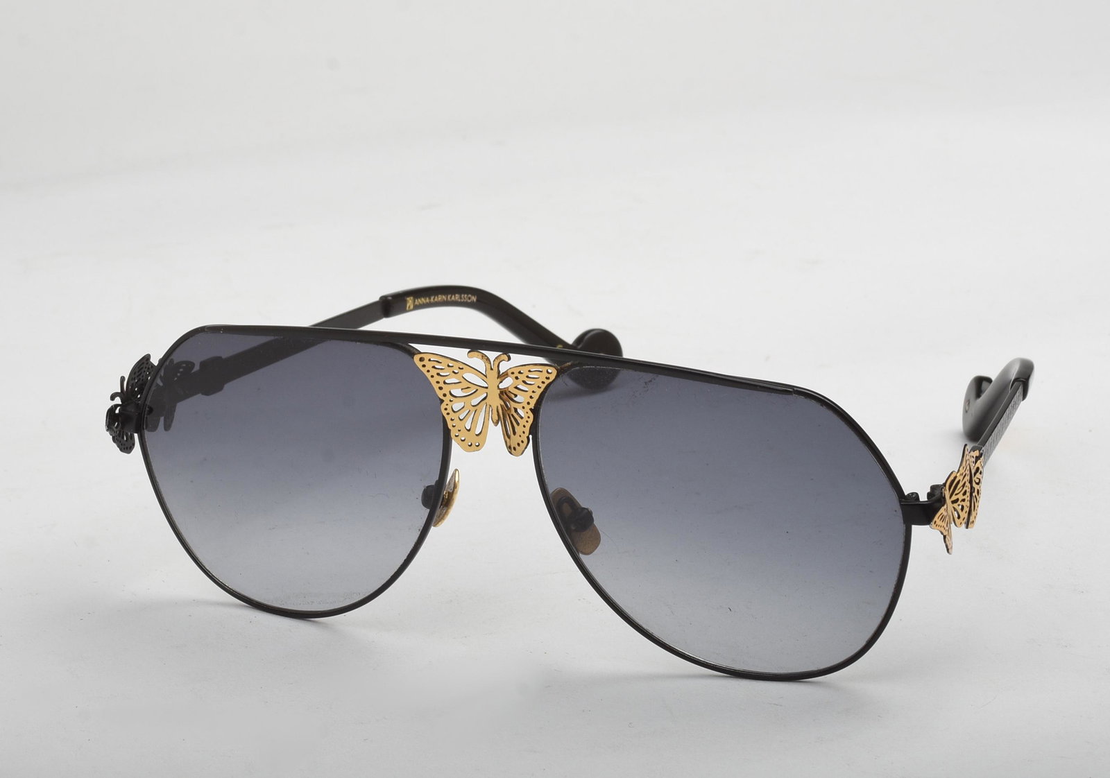 Pair of Anna-Karin Karlsson Butterfly Sunglasses.: .