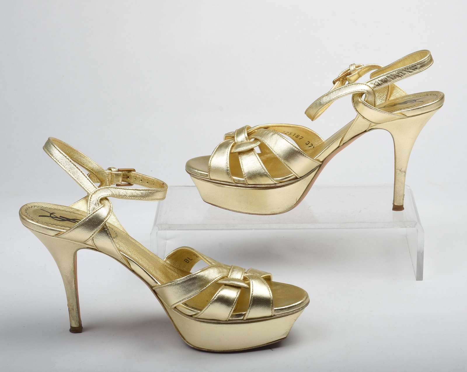 Pair of Yves Saint Laurent Gold Platform Pumps.: Size 37.5. Condition: heel with two indentations, see photo.