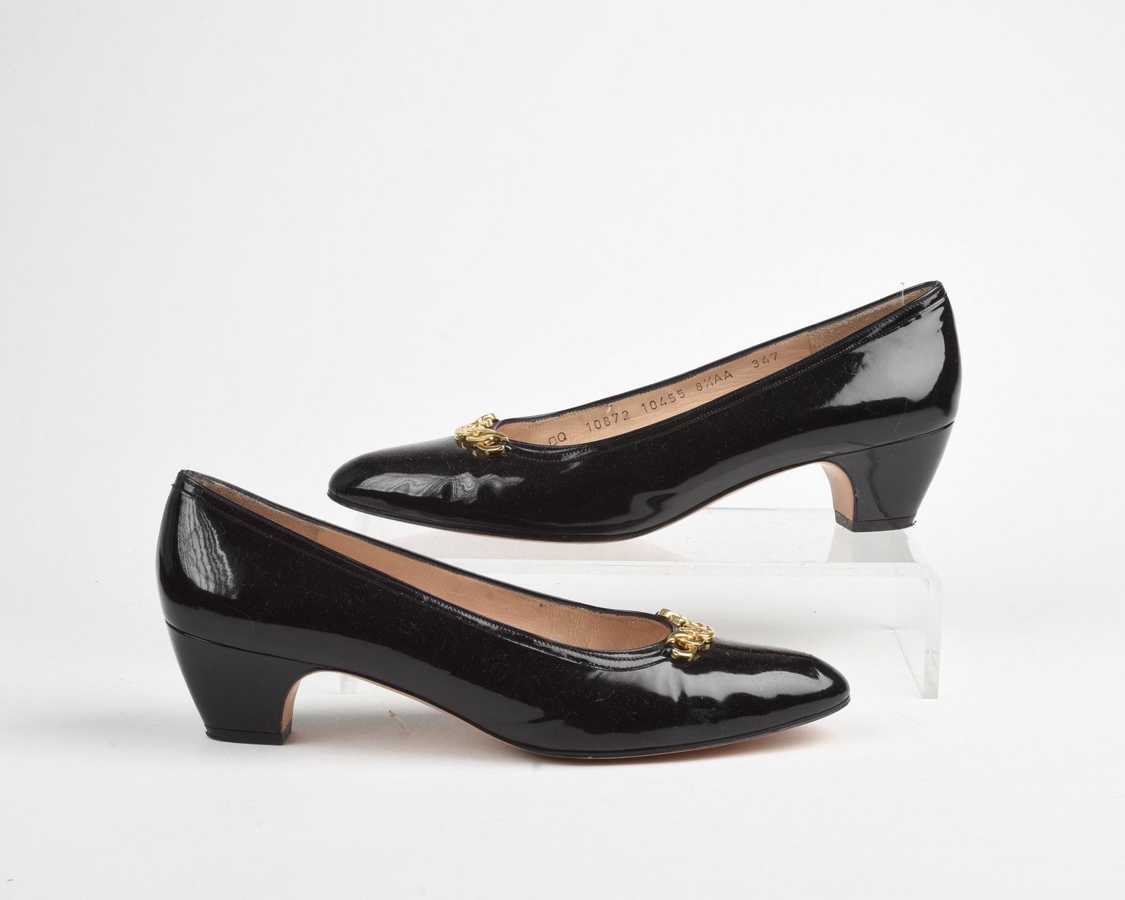 Pair of Feragamo Patent Leather Pumps.: Size 8.5 AA. Condition: like new.