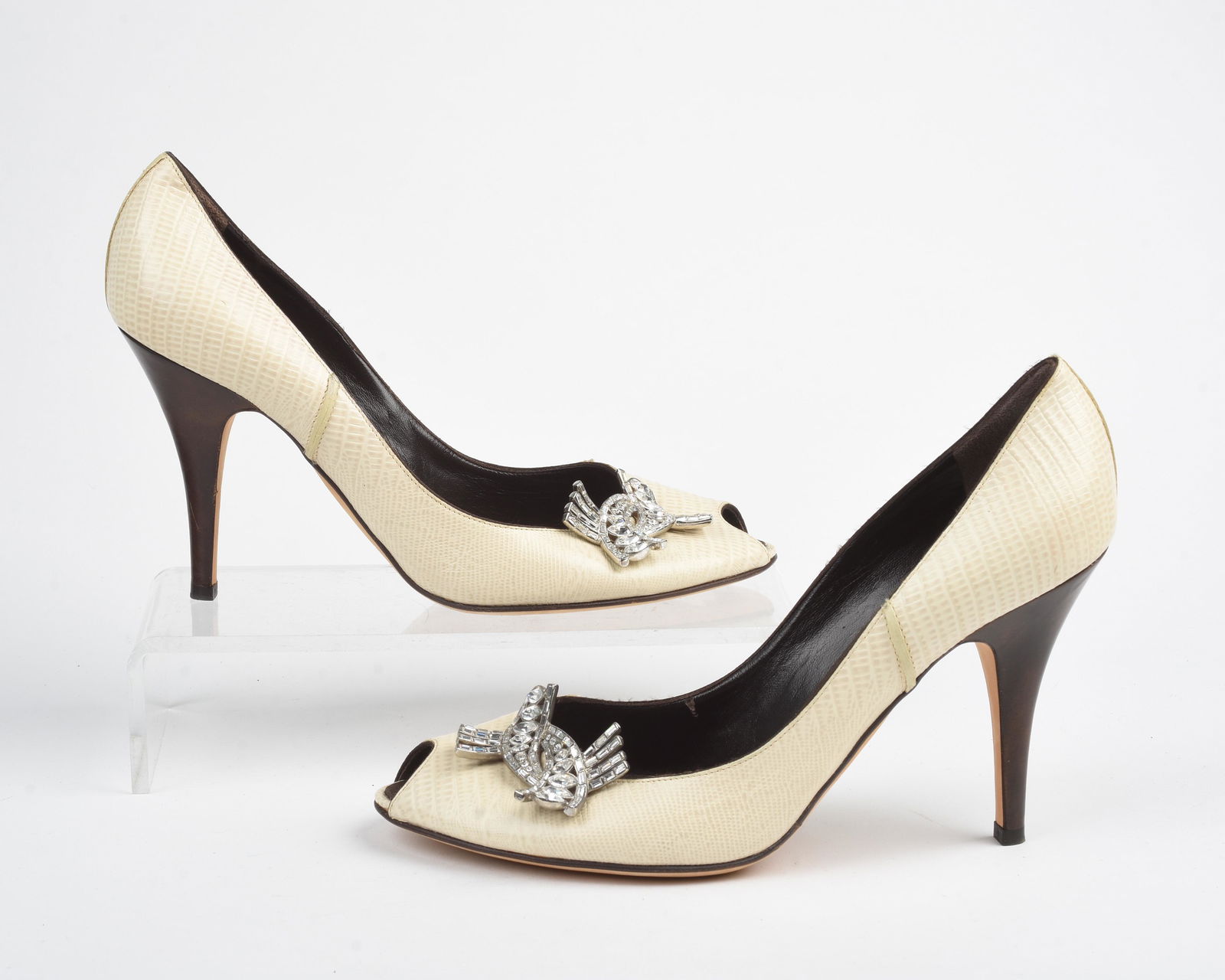 Pair of Giuseppe Zanotti Heels: Adorned with rhinestone show clip. Vicini written on bottom. Heel height: 4 inches. Size 40. Faux reptile material?