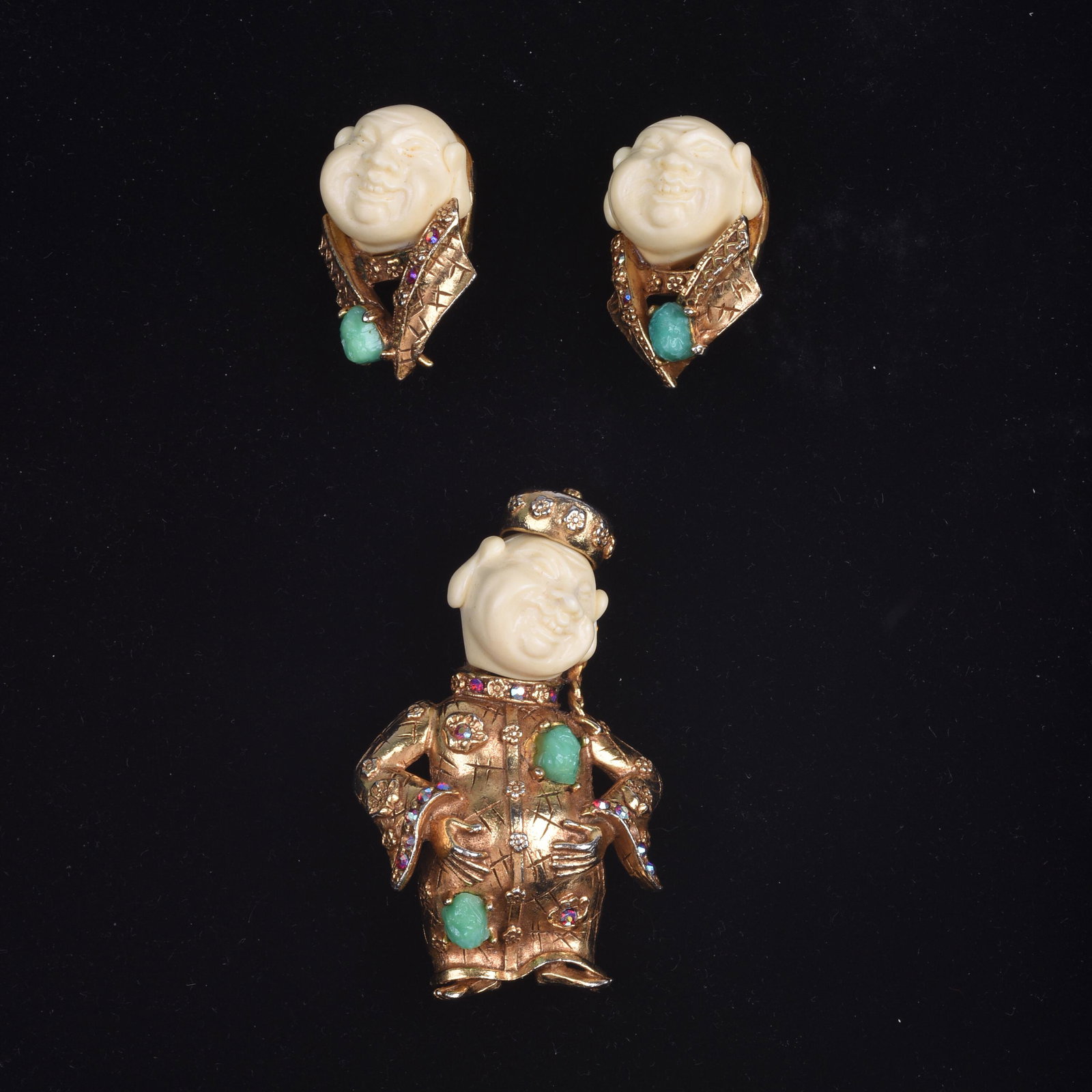 Har Chinese Figure Pin and Earrings.: Base metal, resin head, and rhinestones. Clip-on style earrings. Pin length 2.75 inches. Earrings length, 1.5 inches.
