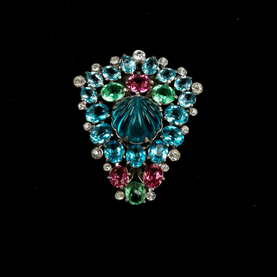 Eisenberg Dress Clip.: Carved melon stone in center with pastel glass handset stones. Unsigned.