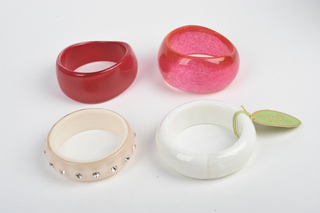 Group of Four Bangle Bracelets.: Diameters 2.5 inches to 2.75 inches.