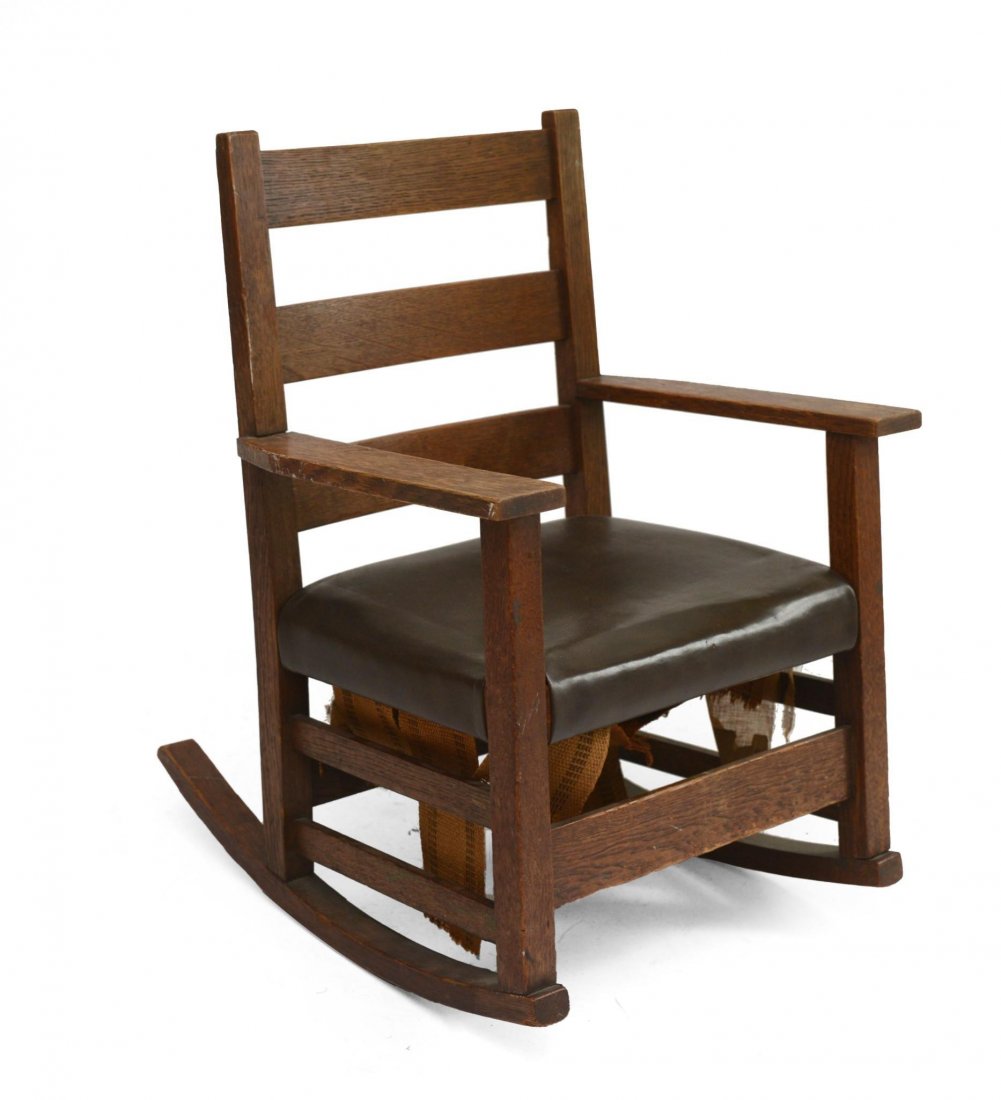Gustav Stickley #345 Child's Rocking Chair.: Height 25 inches, width 18 inches. With paper label, 1907-1912.