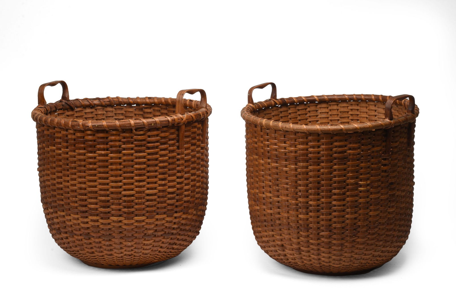 Pair of Robust Nantucket Baskets by Mitchell Ray. (1 of 3)