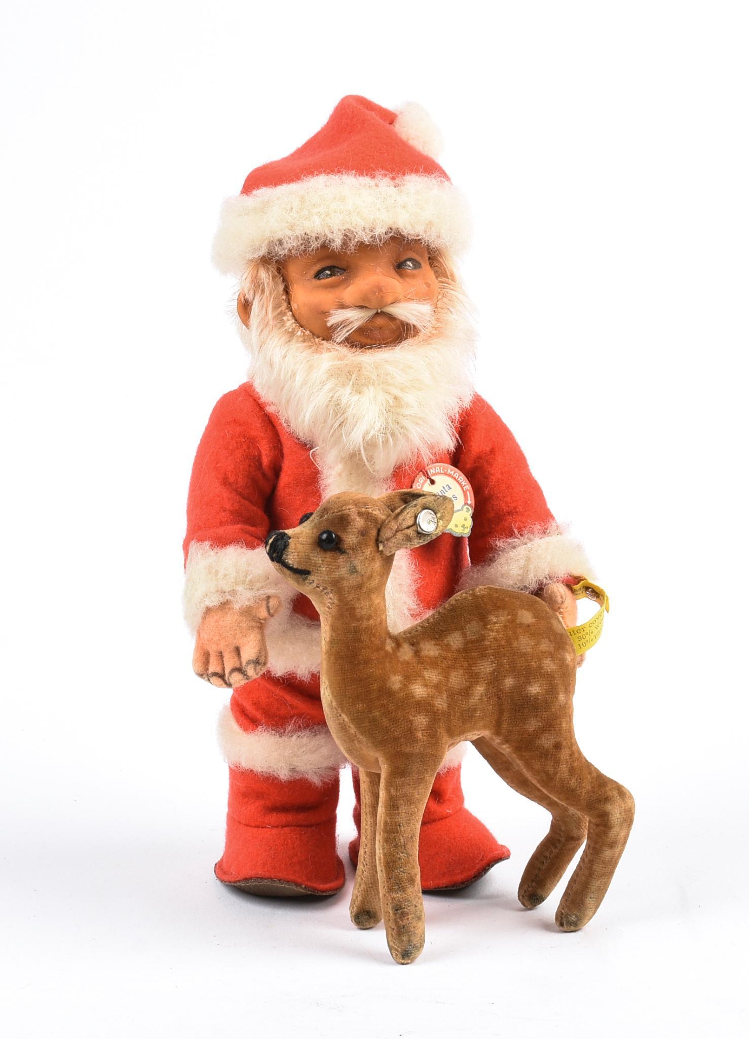 Steiff Santa Claus and a Mohair Reindeer.: Height of Santa 8 inches.