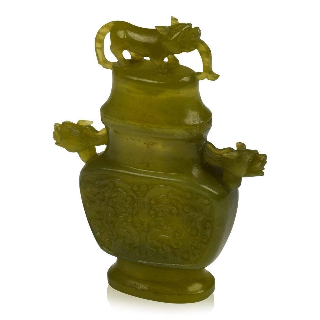 Chinese Carved Hardstone Covered Jar: Height 6.5 inches, archaic decoration with lion finial and lion's head handles.