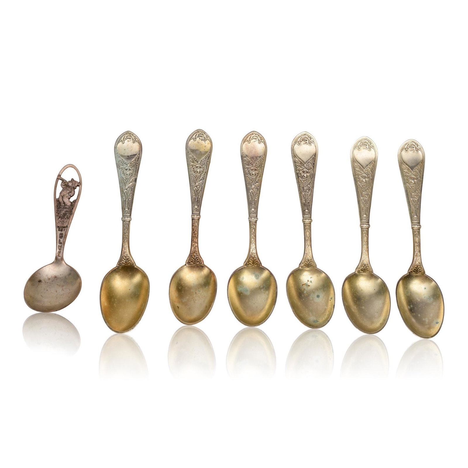 American Silver "Little Boy Blue" Baby Spoon.: Watson Co., Attleboro, Massachusetts Circa 1880. Together with a set of six Aesthetic Movement silver-gilt teaspoons, marked PATENT 1874. Length of teaspoons 4.75 inches.