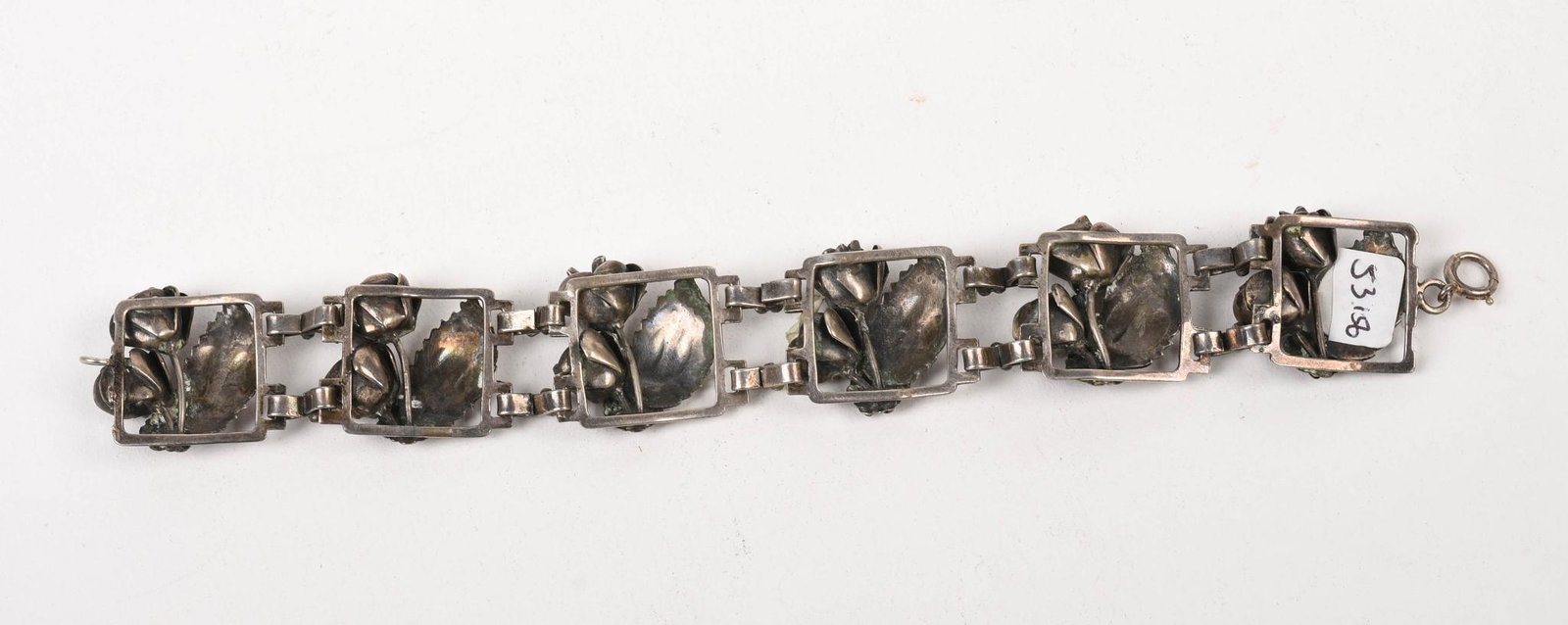 Sterling Bracelet With Leaf and Flower Design.: Length 7 inches, 40 grams.