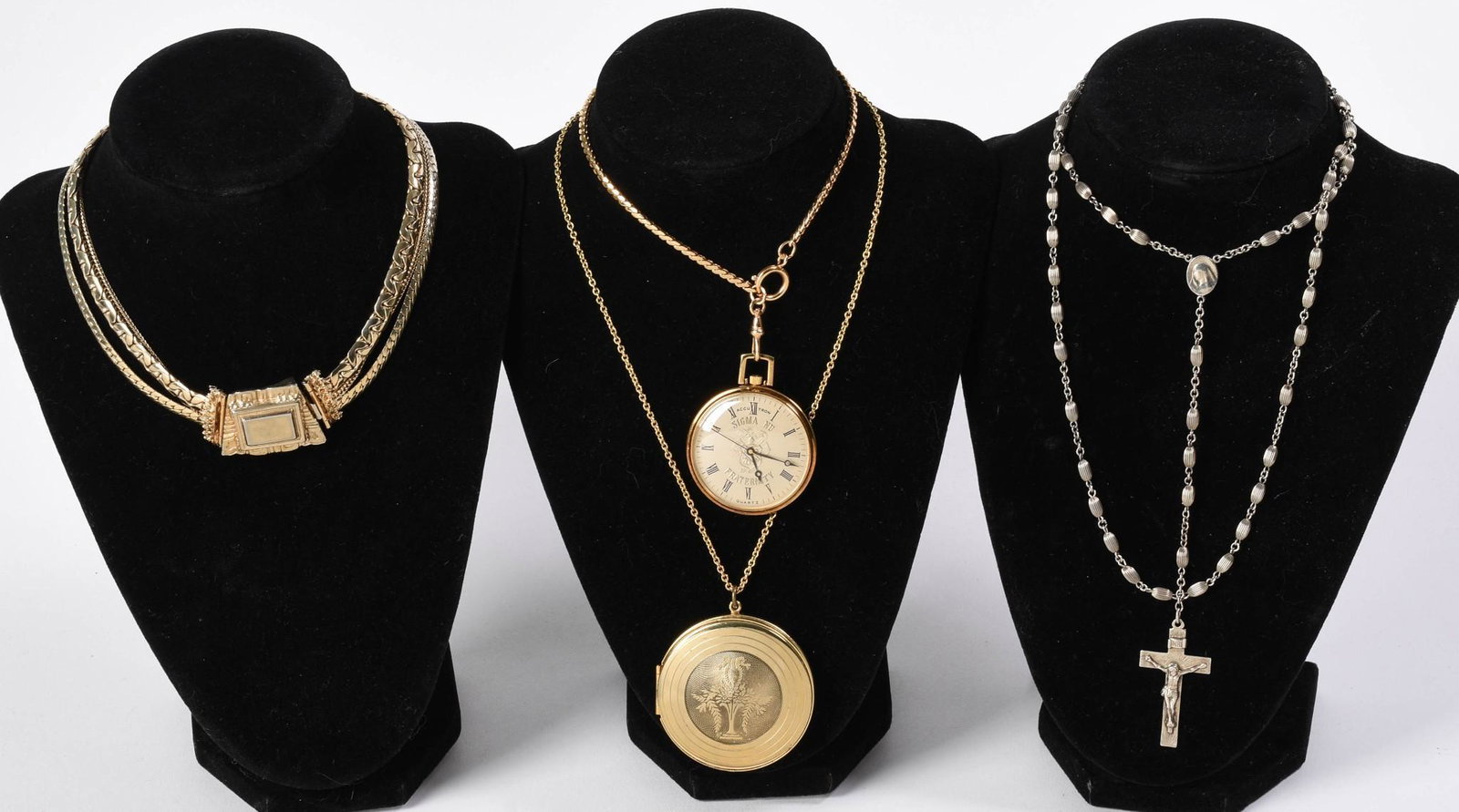 Pocketwatch and Three Necklaces.: A choker, diameter 4 inches, locket necklace, and cross necklace. The pocket watch Accutron Quartz, Sigma Nu Fraternity.