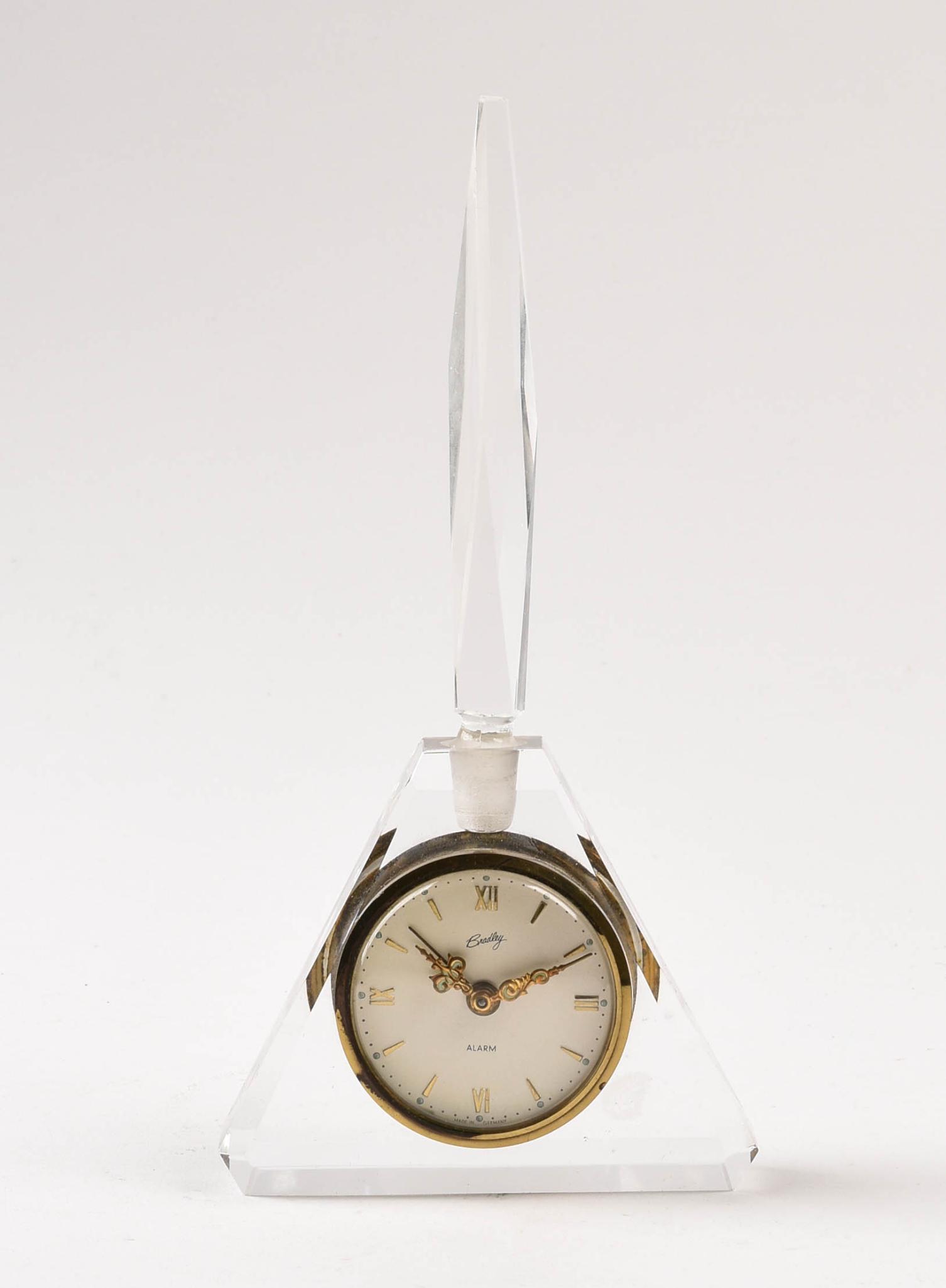 Bradley Perfume Bottle Clock.: Height 9 inches. Appears to be operational.