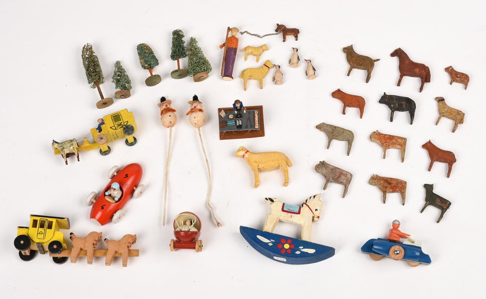 Collection of Miniature Figures.: Includes a horse drawn carriage, length 3.5 inches, rocking horse, carriage, animals, trees, and others.