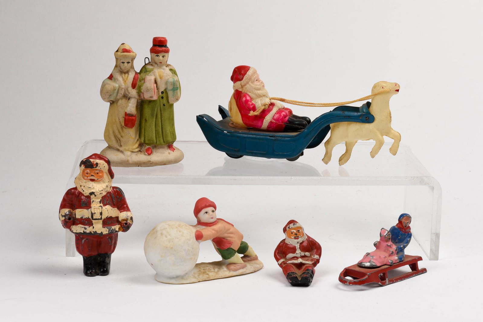 Six Christmas Figurines: Metal, ceramics and celluloid, length of Santa's sleigh 5.5 inches.