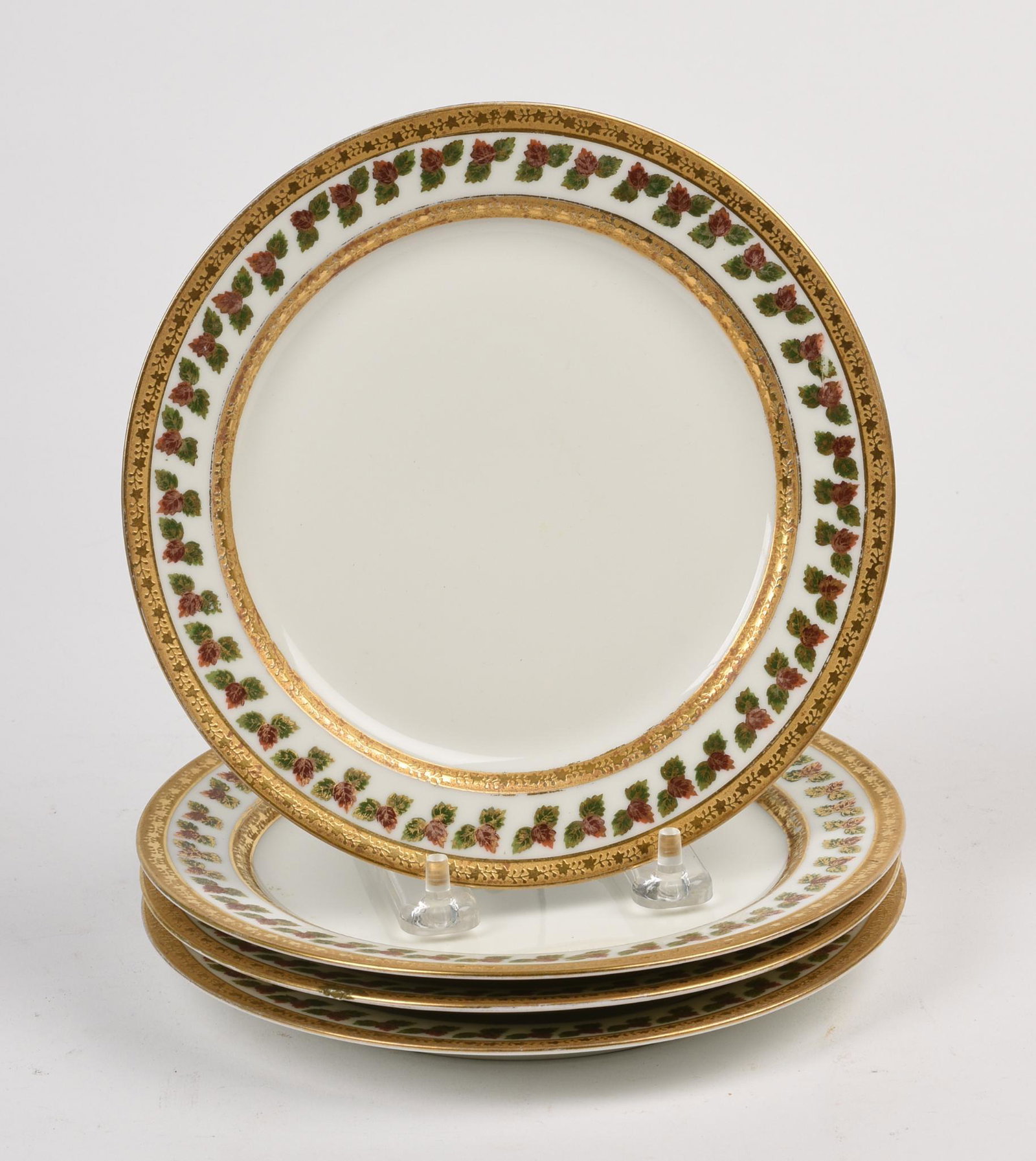 Four PL Limoges Gilt Rimmed Plates.: Diameter 7.375 inches. One with chip to rim.