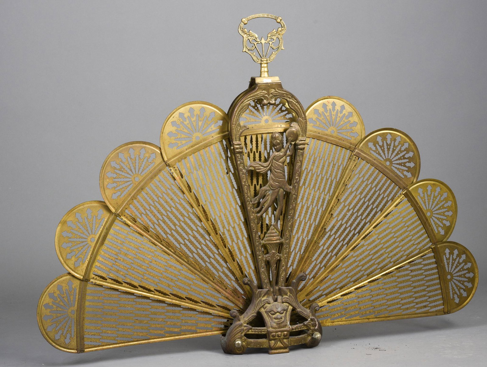 Victorian Brass Fireplace Screen.: With figural decoration, height 33.5 inches. Needs some repair.