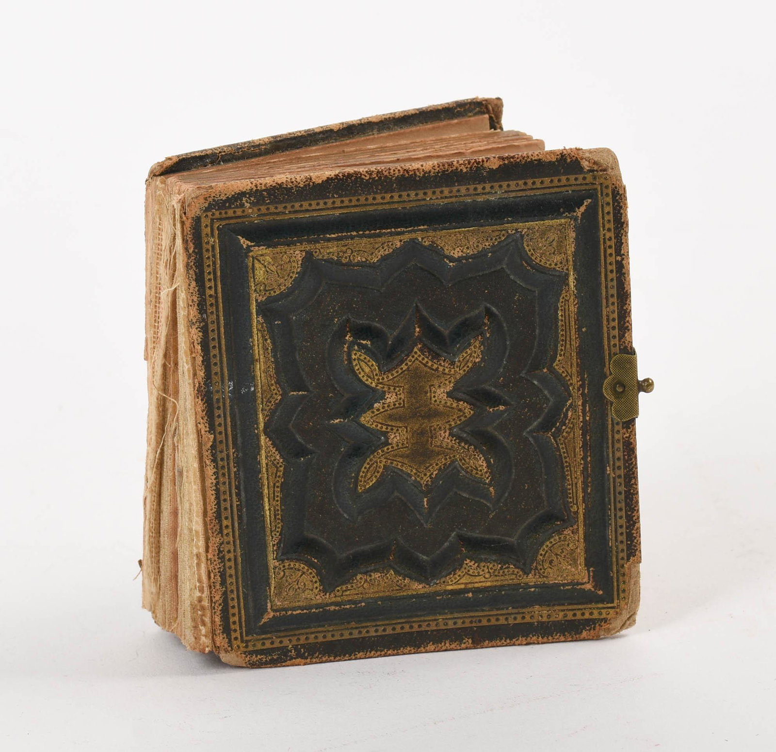 Album of Miniature Tintypes: Containing approximately 80 tintypes, album 3.75 x 3.25 inches. Binding broken.