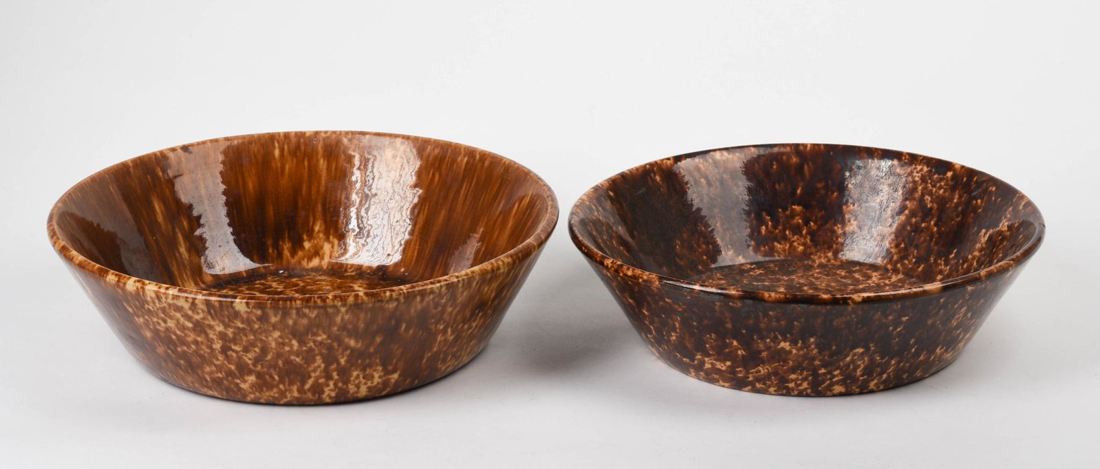 Two Bennington Spongeware Bowls.: Diameters 12 and 13.25 inches.