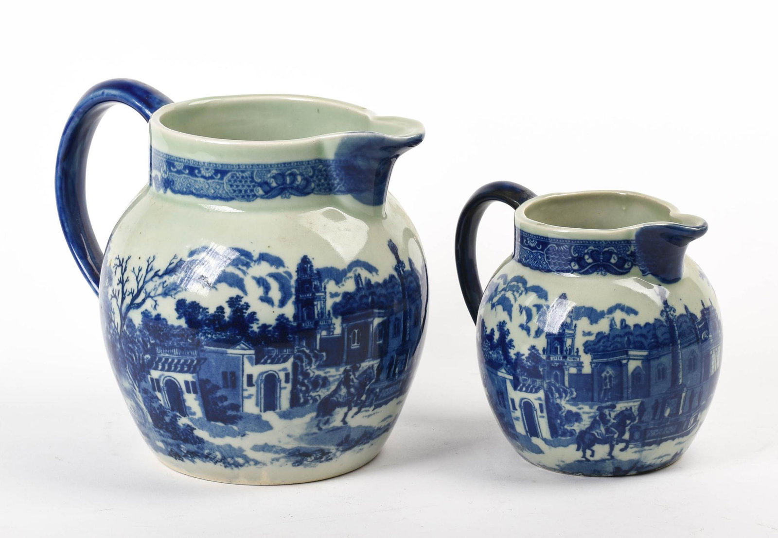 Two Victoria Ware Ironstone Pitchers.: Heights 9 and 6 inches.