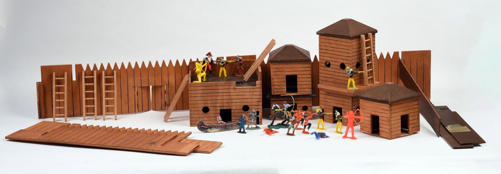 FAO Schwarz Fort and American Indian Figurines.: The fort with stockade fences, towers, buildings and ladders. With numerous plastic figures, in original box.