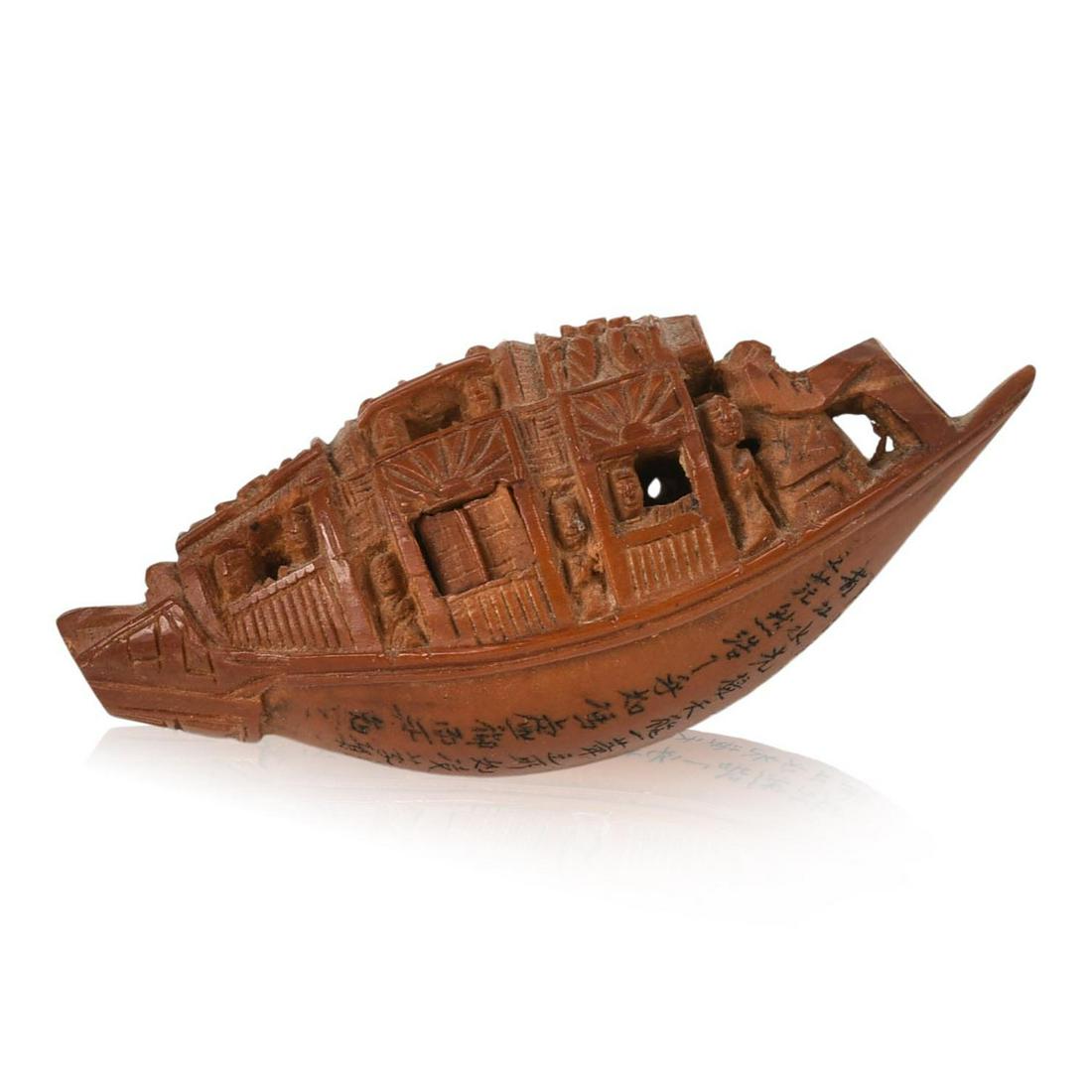 Carved Chinese Peach Pit: Lengthy micro script inscription on bottom, length 1.75 inches.