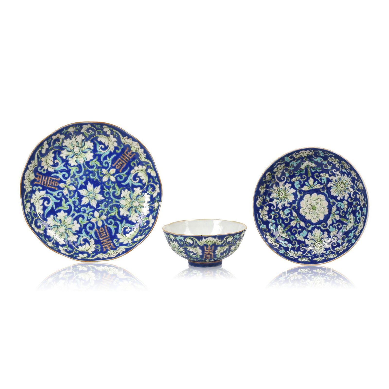 Three Chinese Famille Rose Porcelain Bowls: Two with Daoguang marks, decorated with chrysanthemum, shou and bats on a blue ground, 19th c., diameters 6.25, 5.25 and 3.75 inches.