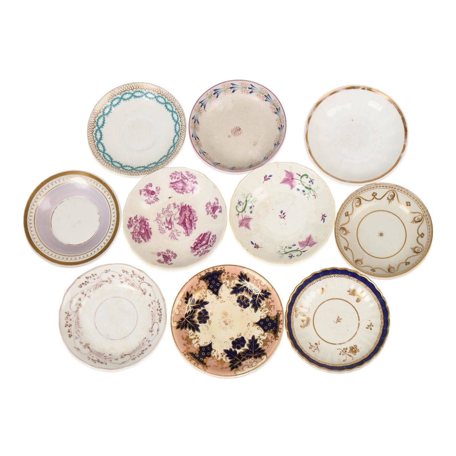 Eleven English Ceramic Saucers.: Unmarked, diameters 5 to 5.75 inches.