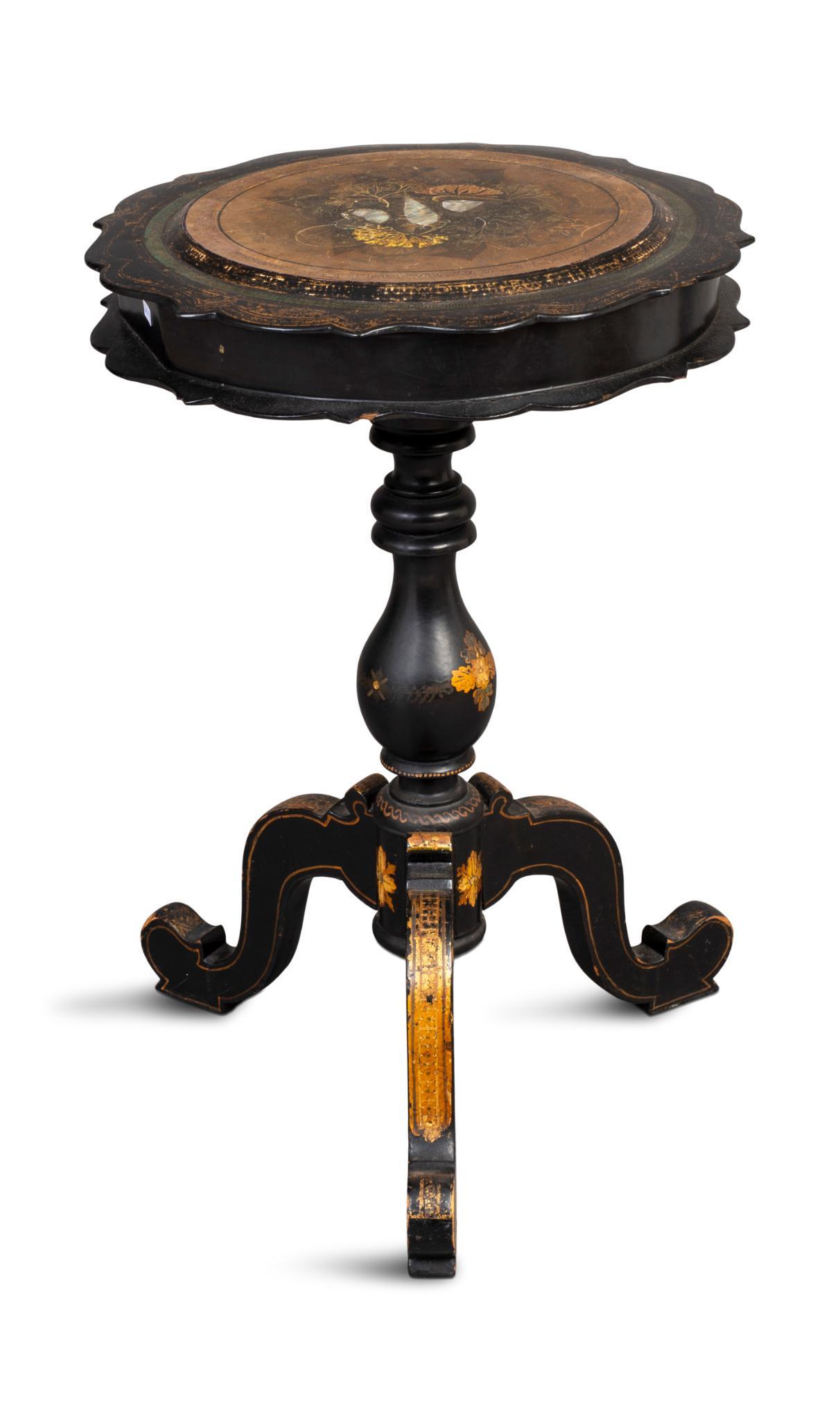 Black Lacquer Sewing Table.: With mother of pearl inlay and gilt decoration, height 28 inches, diameter of top 19 inches. Losses to decoration, some repairs need to interior.