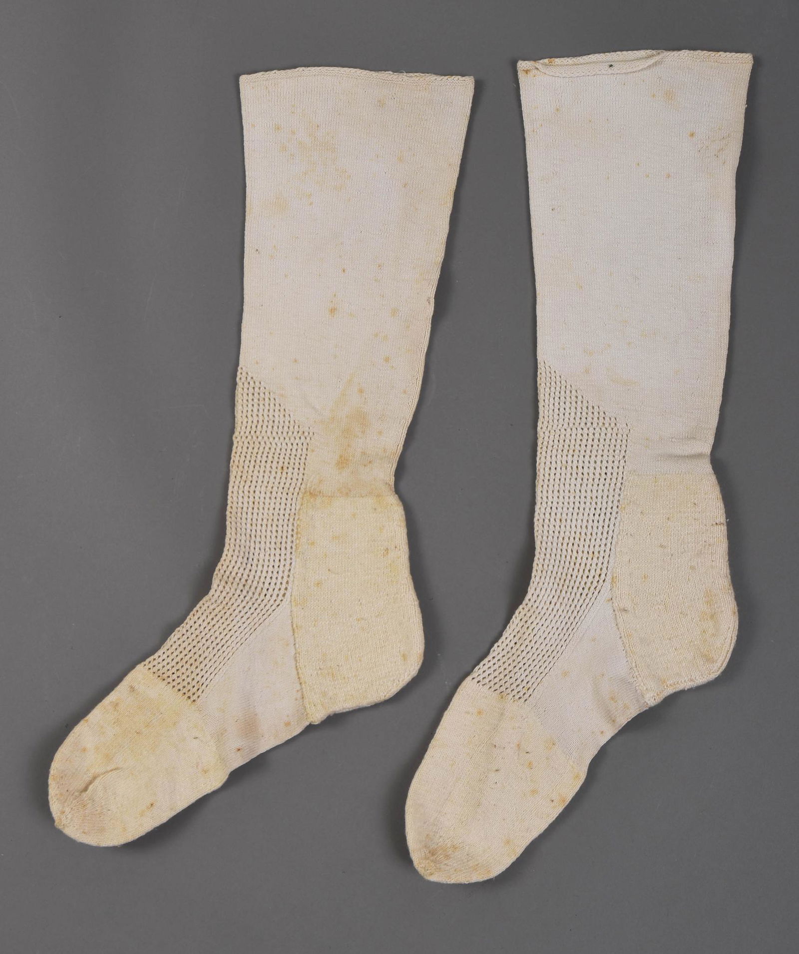Early 19th Century "Half-Stockings": Another pair of early 19th century “half-stockings” frame-knitted of cotton yarn, with decorative honeycomb work on the insteps. Provenance: 2018 sale of Plumer-Humphreys-Barton family est
